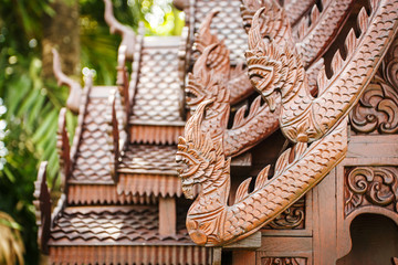 Fototapeta na wymiar Wooden house Thai style wood carving