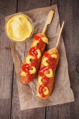 Corn dog with ketchup and mustard