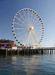 A view  of the piers in downtown Seattle. Tourists throng to the piers which are centers for entertainment.