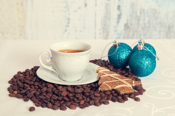 white mug of hot drink on table and xmas decor