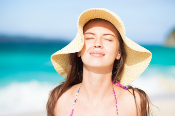long haired girl in straw hat on tropical boracay beach