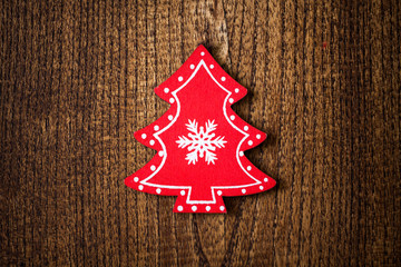 Red Christmas tree ornament on wooden background - 74464832