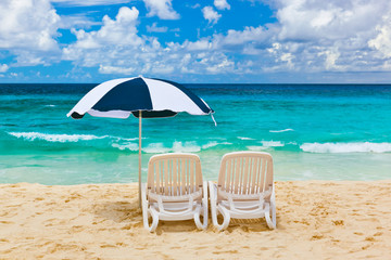 Chairs and umbrella at tropical beach