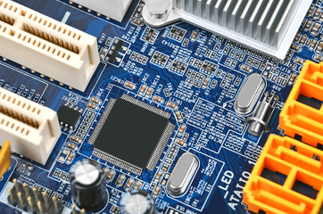 Printed computer motherboard with microcircuit, close up, DOF
