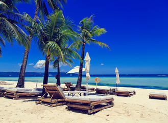Beach chairs on tropical sand beach