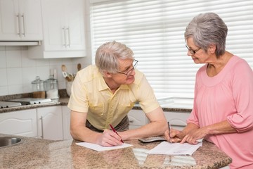 Senior couple paying their bills