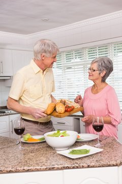 Senior couple preparing lunch together