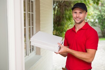 Fototapeta premium Pizza delivery man delivering pizzas