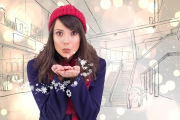 Composite image of festive brunette blowing over hands