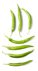 Green chili peppers over white background