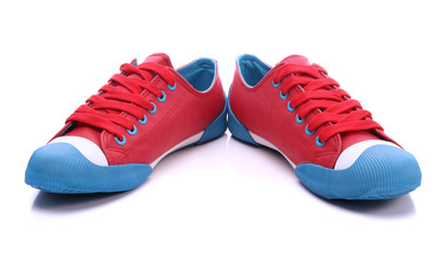 Pair of red sneakers on a white background - obrazy, fototapety, plakaty