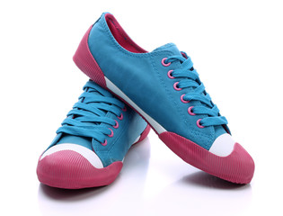 Pair of blue sneakers on a white background