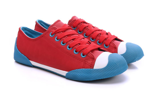 Fototapeta Pair of red sneakers on a white background
