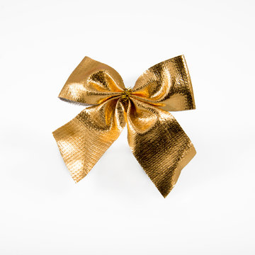Golden bow isolated on white background.