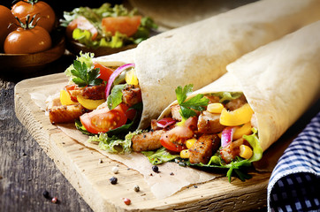 Tortilla wraps filled with fresh salad and meat