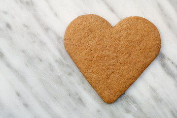 Heart Gingerbread Cookie on marble background