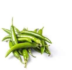 Green chili peppers over white background