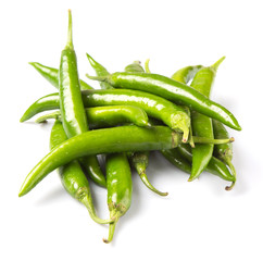 Green chili peppers over white background