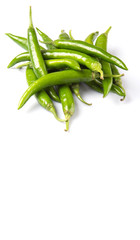 Green chili peppers over white background