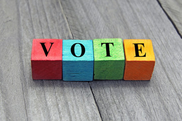 concept of vote word on colorful wooden cubes