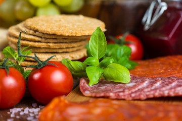 meat snacks with basil and fresh tomatoes