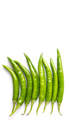 Green chili peppers over white background