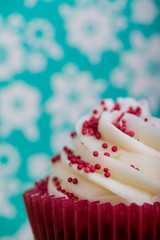 close view on cup cake over colorful background