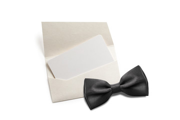 Black bow tie with blank invitation