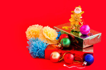 decoration of christmas and gift box on red background