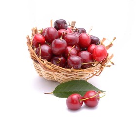 Cherry in basket isolated on white background