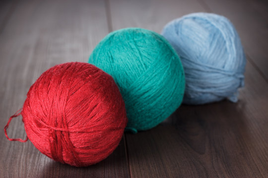 three knitting balls of threads