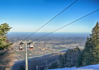 Cable car going to Pohorje over foggy Maribor