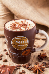 Cappuccino coffee with cinnamon and anise stars