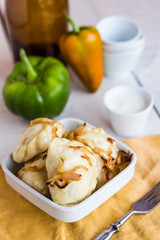 dumplings with potatoes, fried onions and sour cream, Ukrainian