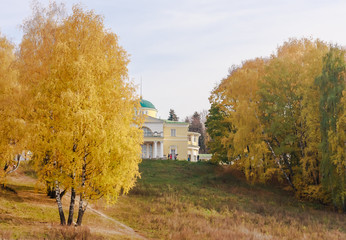 The old mansion in the park in autumn