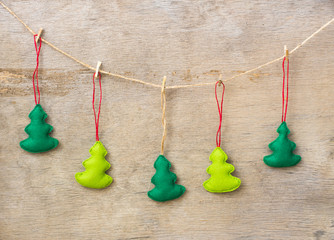 Christmas decoration hanging over wooden background