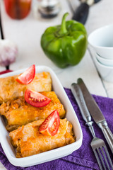 Braised cabbage with meat and rice in tomato sauce