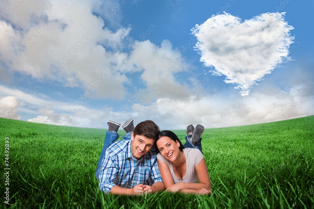 Poster composite image of young couple lying on floor smiling