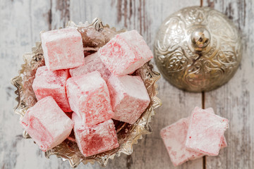 Fototapeta premium Rose Flavoured Turkish Delight on White Wooden Background