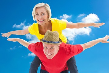 Composite image of mature couple joking about together