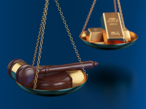 Gold bars with wooden gavel on the scales