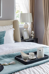 modern bedroom with black tray of tea set