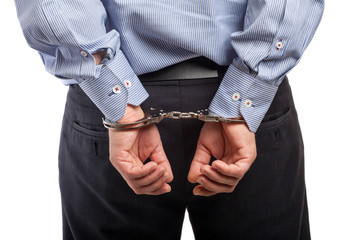 Close up of a man in handcuffs arrested, isolated on white