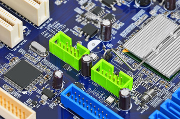 Printed computer motherboard with microcircuit, close up, DOF