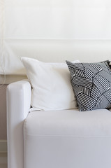 white sofa with black and white pillows