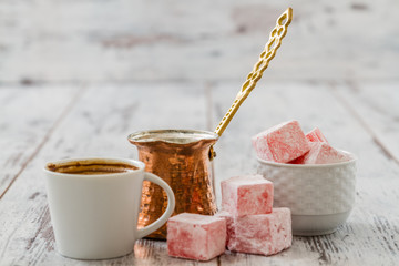 Fototapeta premium Traditional Turkish Coffee Served with Turkish Delight on White Wooden Background