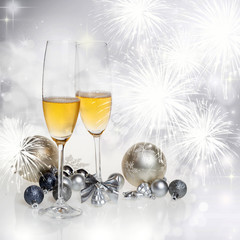 New Year's at midnight - champagne glasses and fireworks