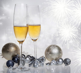 New Year's at midnight - champagne glasses and fireworks