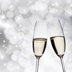 New Year's at midnight - champagne glasses and fireworks