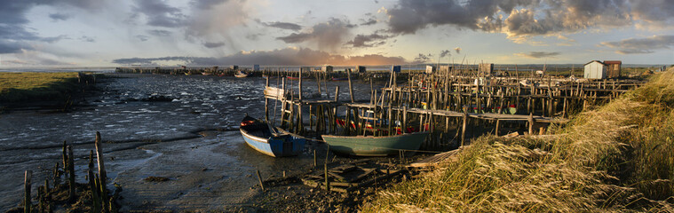 Fototapeta na wymiar View of an old fisherman palaphitic pier on the Sado marshlands.